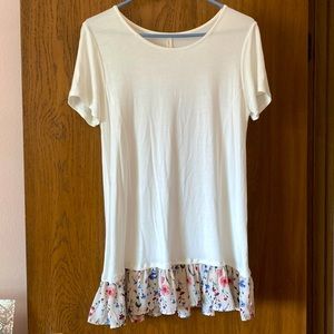 Extra long, ruffle trim tee. Never worn.  Size medium.